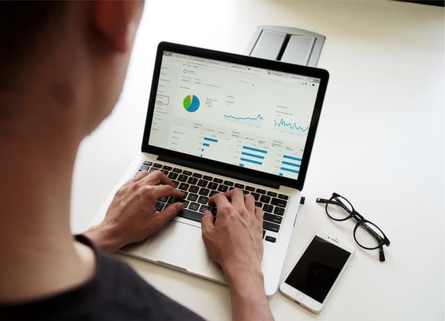 Expand Online Outreach Person Working On Google Analytics