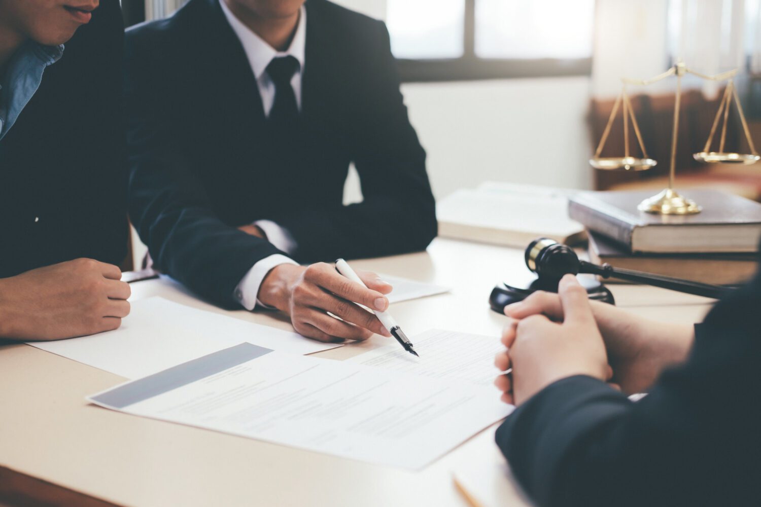 Lawyer And Attorney Having Team Meeting At Law Firm. Lawyer And Attorney Having Team Meeting At Law Firm.