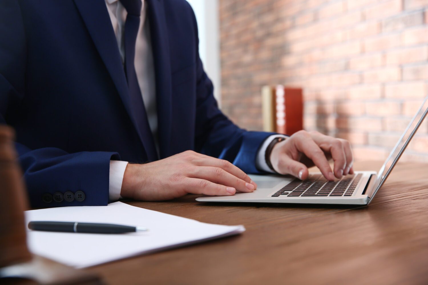 Notary Working With Laptop At Table In Office, Closeup. Law And Justice Concept Notary Working With Laptop At Table In Office, Closeup. Law And Justice Concept
